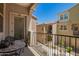 Relaxing balcony offers outdoor seating and views of the neighborhood at 1836 N 77Th Gln, Phoenix, AZ 85035