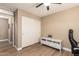 Bedroom with light wood flooring, an entertainment stand, and closet with sliding doors at 1836 N 77Th Gln, Phoenix, AZ 85035