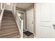 Entryway with stairs, white doors, and light wood flooring at 1836 N 77Th Gln, Phoenix, AZ 85035