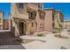 View of the beautiful townhome with a walkway and a charming front porch at 1836 N 77Th Gln, Phoenix, AZ 85035