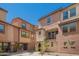Charming multi-level townhome with a well-maintained walkway and front patio at 1836 N 77Th Gln, Phoenix, AZ 85035