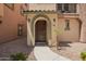 Close-up of the home's front door, walkway, and landscaping at 1836 N 77Th Gln, Phoenix, AZ 85035