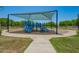 Blue playground area with slides and climbing structures under a shaded canopy, offering a fun space for children at 1836 N 77Th Gln, Phoenix, AZ 85035