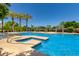 Sparkling community pool boasts a splash pad, a spa, covered cabanas, and shaded seating areas at 1836 N 77Th Gln, Phoenix, AZ 85035