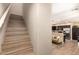 View of the staircase leading to the upper level, and living area at 1836 N 77Th Gln, Phoenix, AZ 85035
