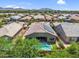 Aerial view of home featuring a pool, solar panels, and patio at 21352 E Domingo Rd, Queen Creek, AZ 85142