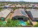 Birds-eye view of the home featuring a backyard pool, patio, and solar panels at 21352 E Domingo Rd, Queen Creek, AZ 85142