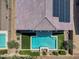 Aerial view of a backyard with a pristine pool, manicured landscaping, and solar panels on the roof at 21352 E Domingo Rd, Queen Creek, AZ 85142