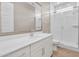 Bright bathroom with quartz counters, updated vanity, and glass enclosed shower with tile surround at 21352 E Domingo Rd, Queen Creek, AZ 85142