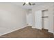 Comfortable bedroom with neutral tones, carpet flooring, and a closet with sliding doors at 21352 E Domingo Rd, Queen Creek, AZ 85142