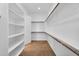 Walk-in closet with custom shelving and clothing racks, providing ample storage space at 21352 E Domingo Rd, Queen Creek, AZ 85142