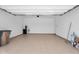 Spacious garage with sealed floors for ease of cleaning and containing an overhead door at 21352 E Domingo Rd, Queen Creek, AZ 85142