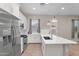 Modern kitchen featuring stainless steel appliances, gas range, and a large island with a sink at 21352 E Domingo Rd, Queen Creek, AZ 85142