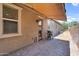 Covered patio with paver flooring, featuring a barbecue grill and a pass through window at 21352 E Domingo Rd, Queen Creek, AZ 85142