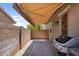 Outdoor patio featuring a retractable awning and built-in BBQ, creating an inviting space for entertaining at 21352 E Domingo Rd, Queen Creek, AZ 85142