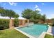 Inviting pool area with a decorative water feature and well-maintained landscaping, perfect for relaxation and recreation at 21352 E Domingo Rd, Queen Creek, AZ 85142