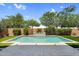 Backyard view of a refreshing swimming pool, lush landscaping, and a beautiful patio at 21352 E Domingo Rd, Queen Creek, AZ 85142