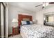Cozy bedroom featuring a ceiling fan and mirrored closet doors at 2228 N 52Nd St # 140, Phoenix, AZ 85008