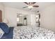 Bright bedroom with ceiling fan, closet, and en suite bathroom at 2228 N 52Nd St # 140, Phoenix, AZ 85008