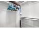 Walk-in closet with hanging rods, shelving, and ample storage space at 2228 N 52Nd St # 140, Phoenix, AZ 85008