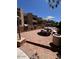 A well-appointed outdoor picnic area with barbecue grills, stone seating, and shade umbrellas for residents at 2228 N 52Nd St # 140, Phoenix, AZ 85008