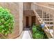 Building entry with stairs to the upper units and secure entry doors at 2228 N 52Nd St # 140, Phoenix, AZ 85008