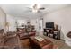 Open living room featuring a dark leather sofa set and access to kitchen and dining area at 2228 N 52Nd St # 140, Phoenix, AZ 85008