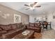 Comfortable living room showcasing a dark leather sofa set and view to the dining area at 2228 N 52Nd St # 140, Phoenix, AZ 85008