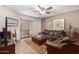 Inviting living room featuring a ceiling fan, stylish decor and sliding door access to the patio at 2228 N 52Nd St # 140, Phoenix, AZ 85008