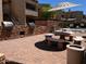 Community outdoor patio with brick accents, tables and chairs, and outdoor grills at 2228 N 52Nd St # 140, Phoenix, AZ 85008