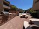 Community outdoor patio with brick accents, tables and chairs, and outdoor grills at 2228 N 52Nd St # 140, Phoenix, AZ 85008