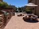 Community outdoor patio with brick accents, tables and chairs, and outdoor grills at 2228 N 52Nd St # 140, Phoenix, AZ 85008