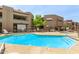 Relaxing pool featuring ample seating and a tranquil atmosphere, perfect for enjoying the community's outdoor amenities at 2228 N 52Nd St # 140, Phoenix, AZ 85008