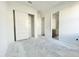 Bright bedroom featuring a closet with sliding doors and en-suite bathroom entrance at 22669 E Saddle Way, Queen Creek, AZ 85142