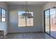 Bright dining area features large windows with backyard views, enhancing the space at 22669 E Saddle Way, Queen Creek, AZ 85142