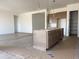 Transitional kitchen with center island, plenty of cabinets and access to the adjacent rooms at 22669 E Saddle Way, Queen Creek, AZ 85142