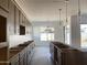 Modern kitchen featuring spacious island and cabinet storage at 22669 E Saddle Way, Queen Creek, AZ 85142