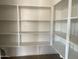 Bright white pantry with ample shelving, providing plenty of storage space at 22669 E Saddle Way, Queen Creek, AZ 85142