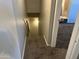 Carpeted stairs leading down into the basement with light at 2301 E University Dr # 269, Mesa, AZ 85213