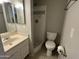 Neutral bathroom featuring tile flooring, a walk-in shower, and a single sink vanity at 2301 E University Dr # 269, Mesa, AZ 85213