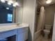 Bathroom with vanity, mirror, and shower-tub combo at 2301 E University Dr # 269, Mesa, AZ 85213