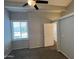 A bedroom featuring a neutral color scheme, ceiling fan, and a window with blinds at 2301 E University Dr # 269, Mesa, AZ 85213