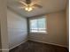 Bedroom showcasing a neutral palette, ceiling fan, and a well-lit window with blinds at 2301 E University Dr # 269, Mesa, AZ 85213