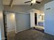 Spacious bedroom with ensuite bathroom featuring carpeted floors at 2301 E University Dr # 269, Mesa, AZ 85213