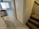 Hallway featuring tile flooring, a closet, and stairs with carpet at 2301 E University Dr # 269, Mesa, AZ 85213