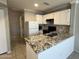 Updated kitchen with granite countertops, stainless steel appliances, and storage options at 2301 E University Dr # 269, Mesa, AZ 85213