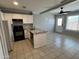 Updated kitchen with white cabinets, stainless steel appliances, and an open dining area at 2301 E University Dr # 269, Mesa, AZ 85213