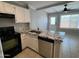 This modern kitchen has granite countertops and black appliances at 2301 E University Dr # 269, Mesa, AZ 85213