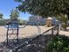 View of neighborhood playground with climbing structure and slide on a gravel base at 2301 E University Dr # 269, Mesa, AZ 85213