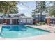 Clear, clean pool in community near pool house, gazebo and other residential buildings at 2301 E University Dr # 269, Mesa, AZ 85213
